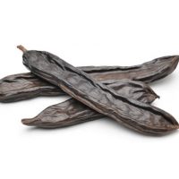 Dry carob isolated on white background